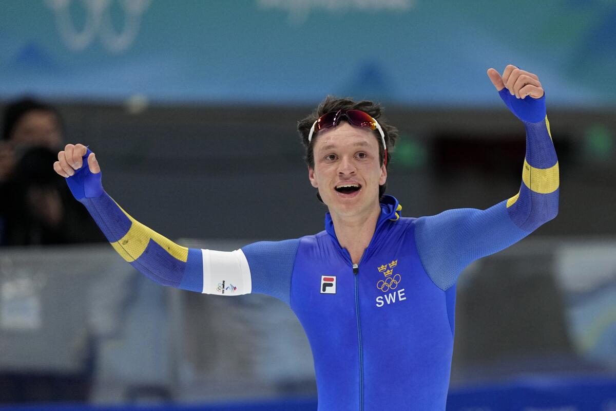 Nils van der Poel of Sweden celebrates after winning the gold medal.
