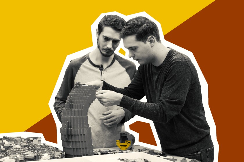 Photo illustration of two men building a curved tower out of Lego