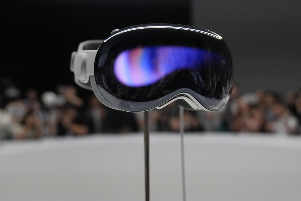 A virtual reality headset that looks like a pair of ski goggles is on display.

