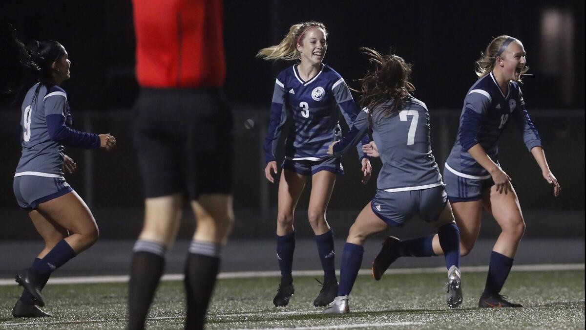 Newport Harbor High's Reese Bodas (3), shown celebrating a goal against Edison in a Sunset Conference crossover match on Dec. 18, 2018, helped the Sailors to a 2-1 win over Laguna Beach Thursday.