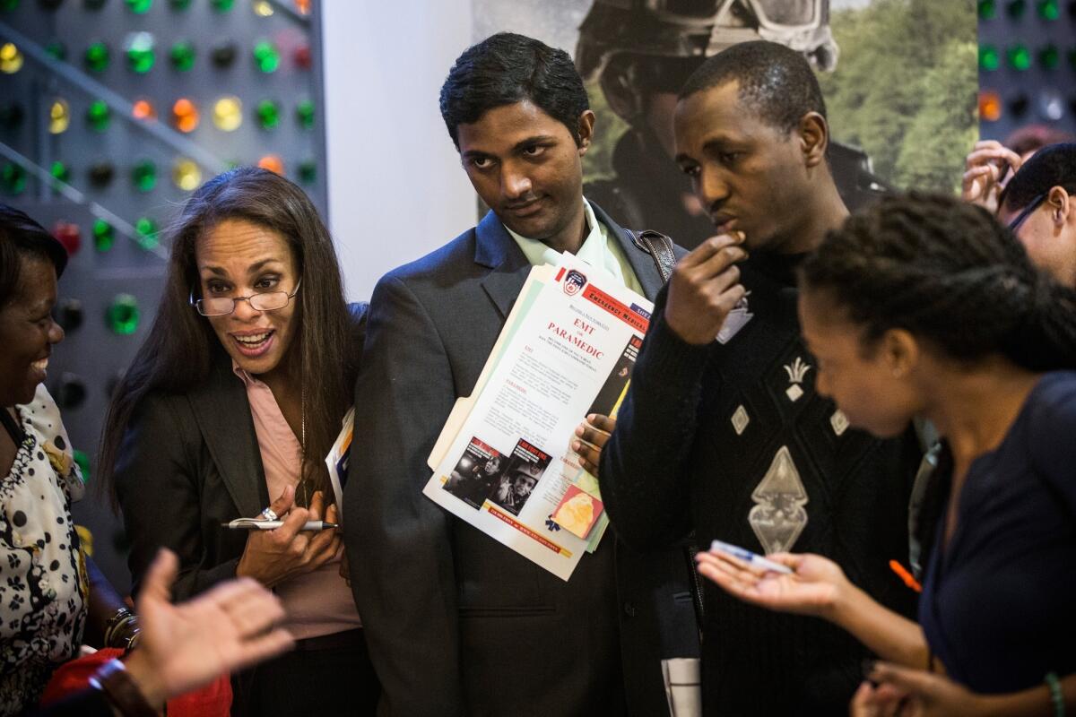 Prospective employees attend a job fair at the Bronx Public Library on Wednesday in New York.