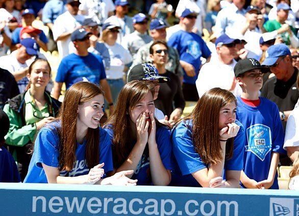 Fans cheer at the Dodgers season home opener Monday against the San Francisco Giants.