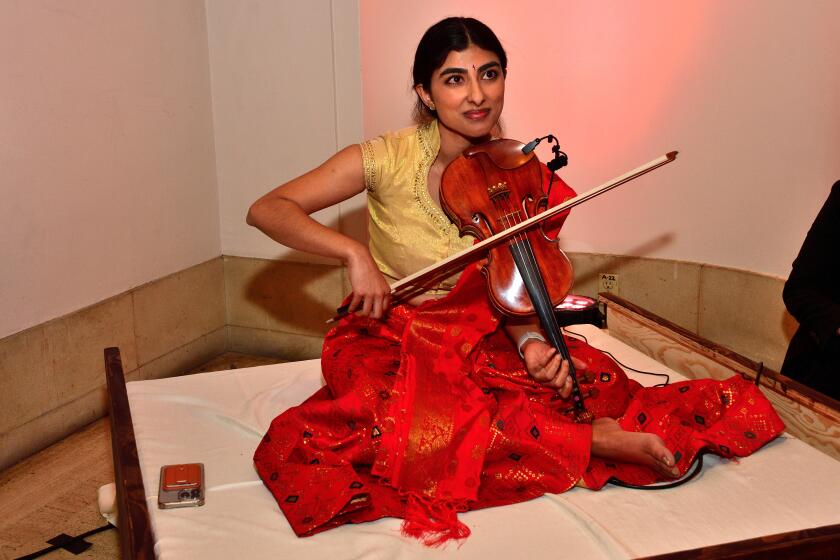 Violinist Aishwarya performs before the Art Alive Premiere Dinner at the San Diego Museum of Art on April 25.