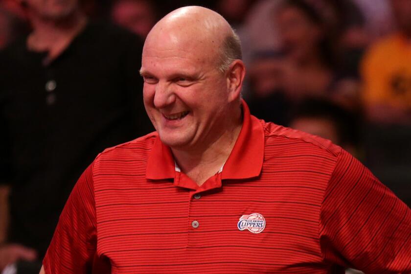 Clippers owner Steve Ballmer smiles while watching his team beat the Lakers at Staples Center on Oct. 31.