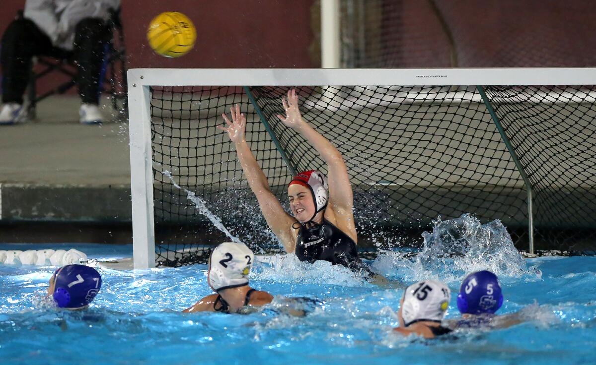Newport Harbor goalkeeper Anna Reed deflects a lob shot during Thursday's CIF Southern Section Division 1 playoff opener against Santa Margarita at Saddleback College.