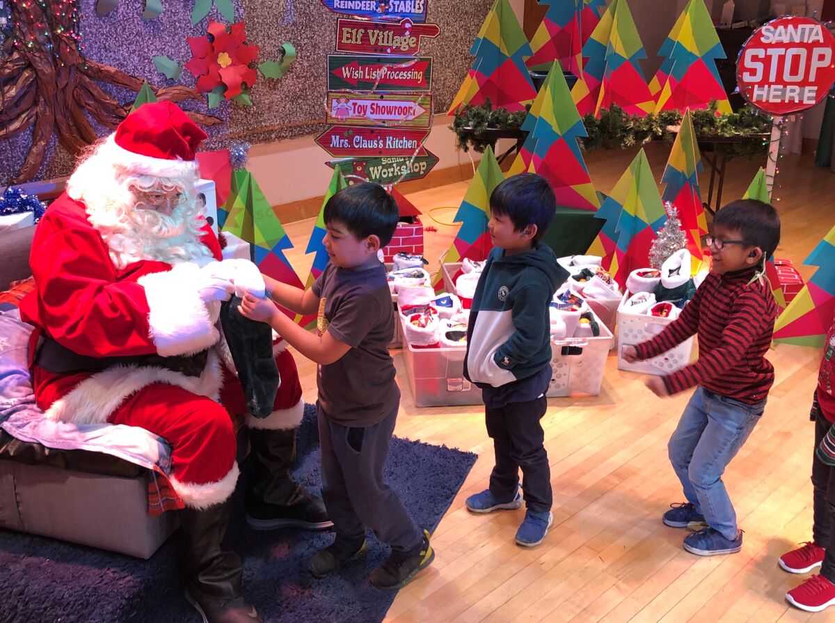 Santa handed out gifts to students at Ross Elementary School.