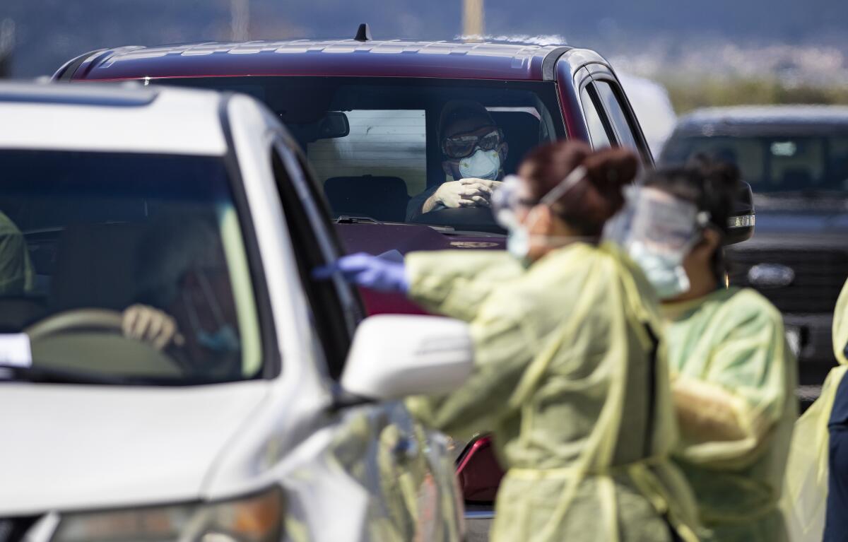 Riverside County medical personnel at a drive-through testing facility