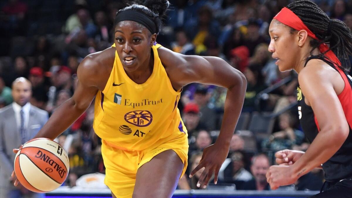 The Sparks' Chiney Ogwumike drives against the Aces' A'ja Wilson on May 26, 2019, in Las Vegas.