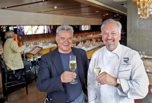 Steve Garcia, left, who is now a restaurateur in Santa Fe, N.M., and chef John Rivera Sedlar at Sedlar's Rivera restaurant.