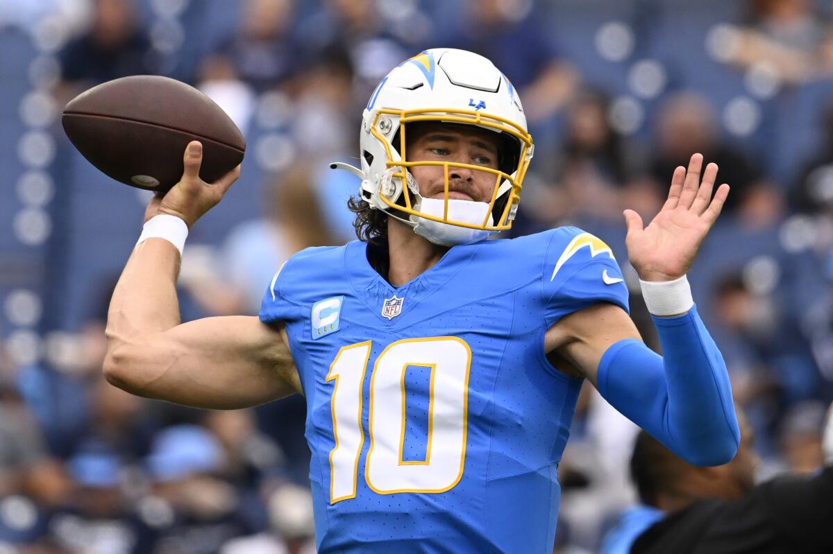 Chargers quarterback Justin Herbert warms up before a road game against the Tennessee Titans.