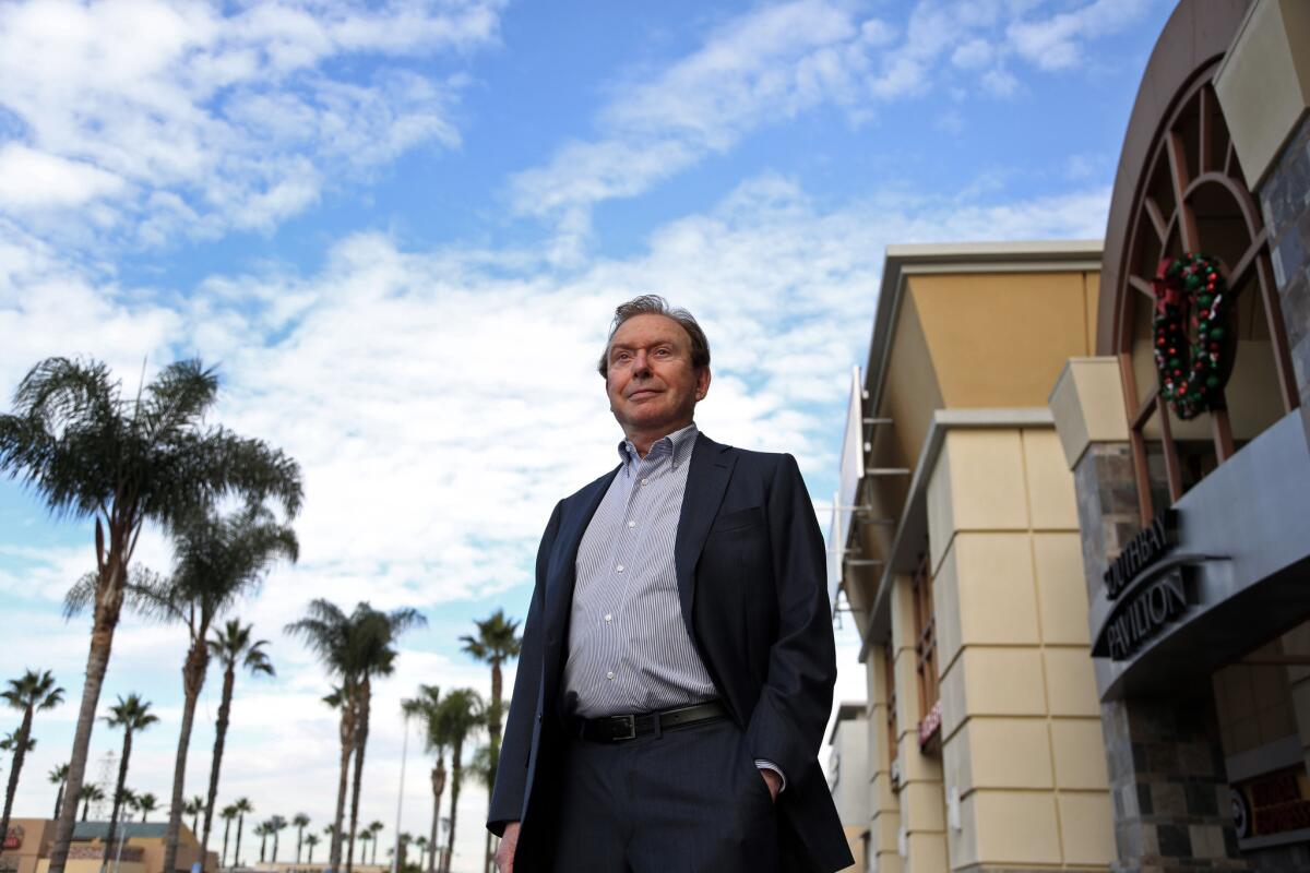 Fred Sands outside the SouthBay Pavilion Mall, one of the many shopping centers he acquired.