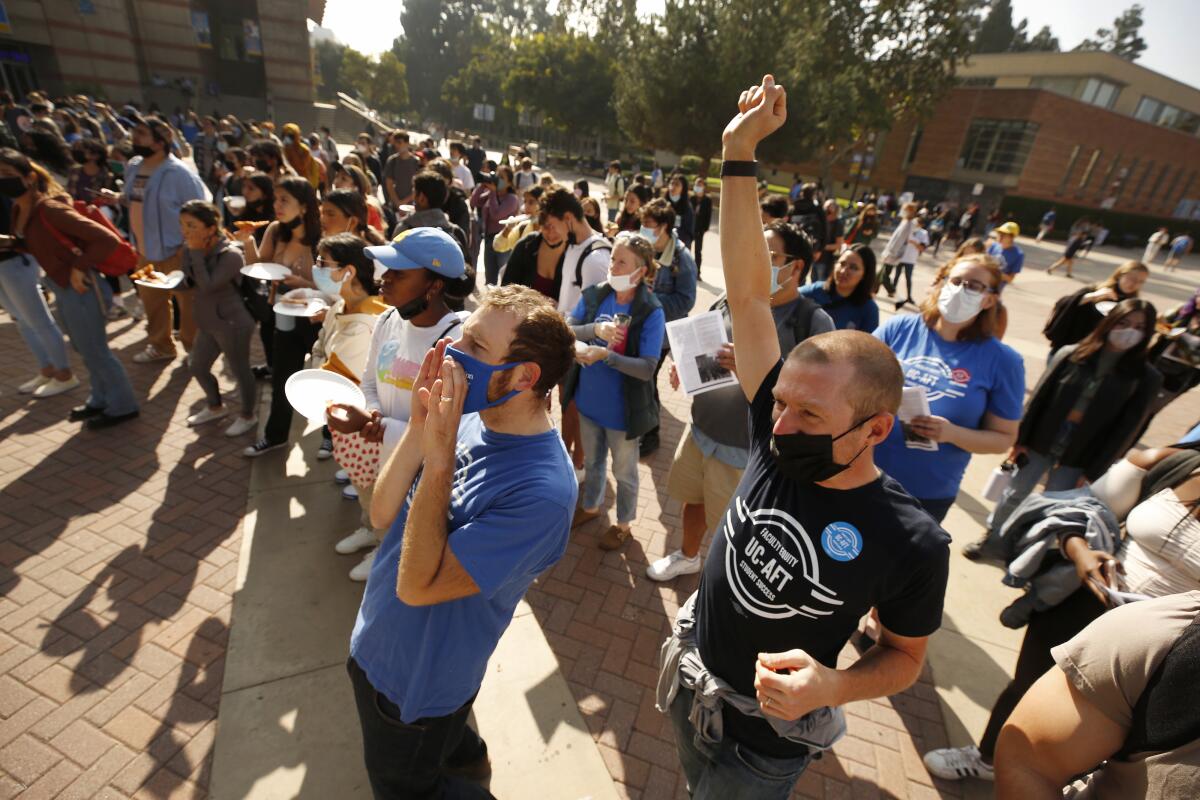 UCLA Political Science Lecturers Cody Trojan, left, and John Branstetter, right, celebrate 