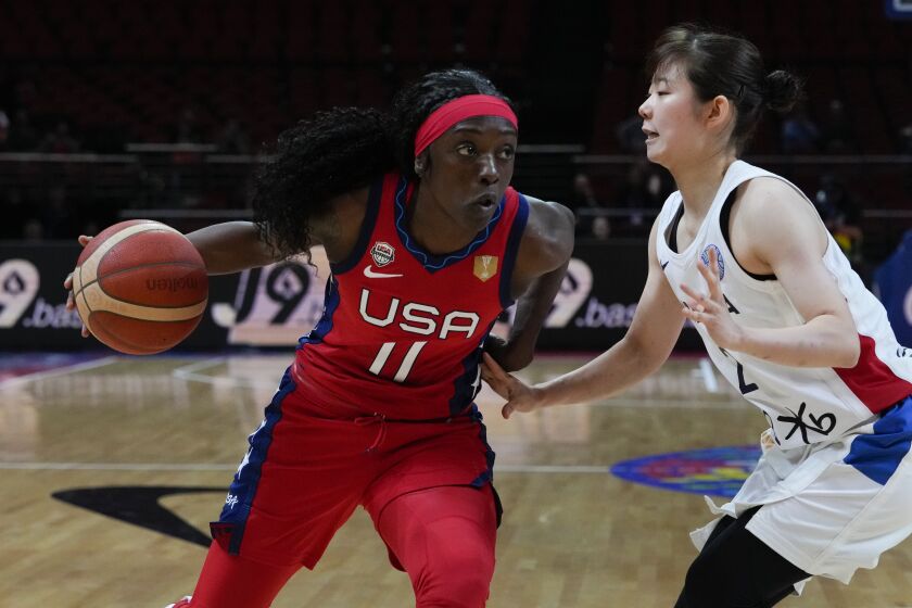 United States' Kahleah Copper runs past South Korea's Heo Yeeun during their game at the women's Basketball World Cup in Sydney, Australia, Monday, Sept. 26, 2022. (AP Photo/Mark Baker)