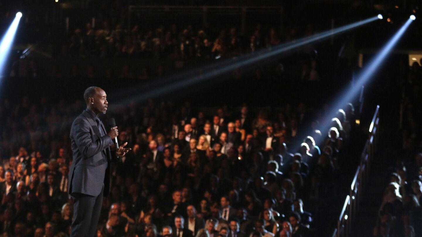 Don Cheadle introduces a performance by Kendrick Lamar.