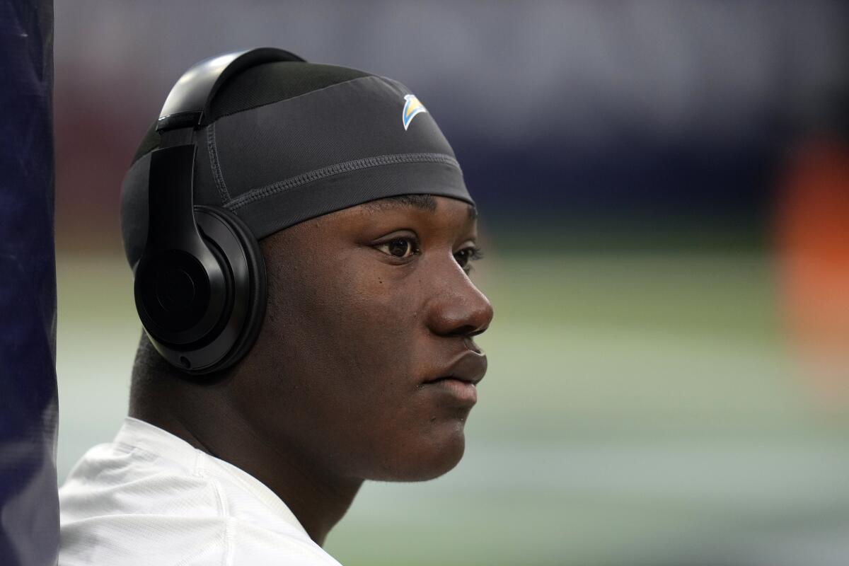 Chargers middle linebacker Kenneth Murray Jr. wears headphones before a game.
