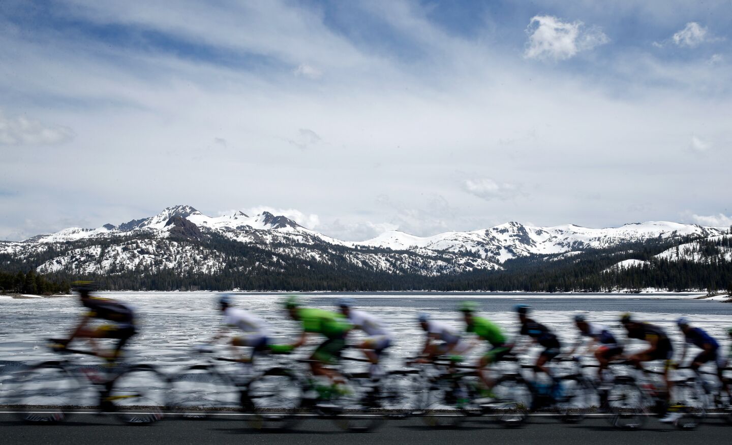 Riders in the peleton cycle along Caples Lake during the fifth stage of the Amgen Tour of California on May 19.