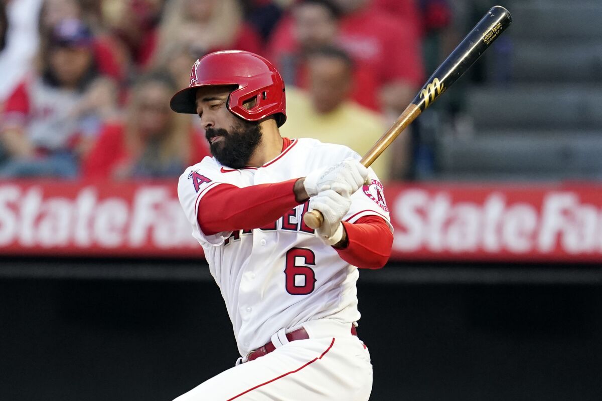 The Angels' Anthony Rendon follows through on an RBI single against Cleveland in April.