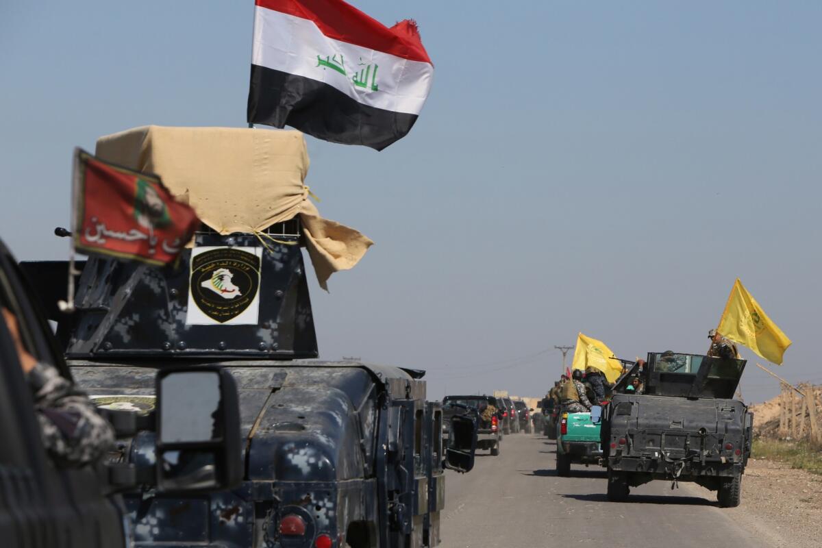 Iraqi security forces coming from the city of Samarra, north of Baghdad, head toward the Dawr area south of Tikrit on Feb. 28 as they prepare to launch an assault against Islamic State militants.