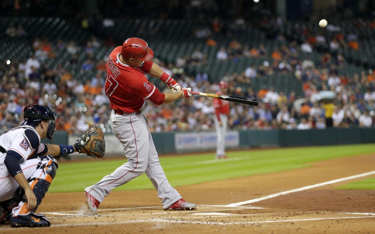 Angels outfielder Mike Trout hits a two-run home run against the Astros in the first inning.