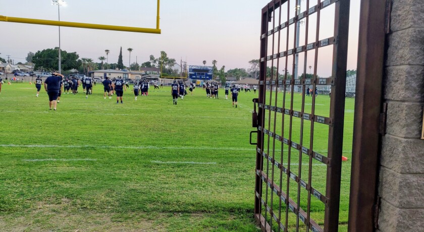 The prison "gates" at Yuma High's Doan Field that Criminals players run through before each game.