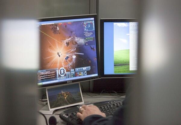 An employee of Cryptic Studios plays a beta version of the game at the company's headquarters in Los Gatos, Ca.