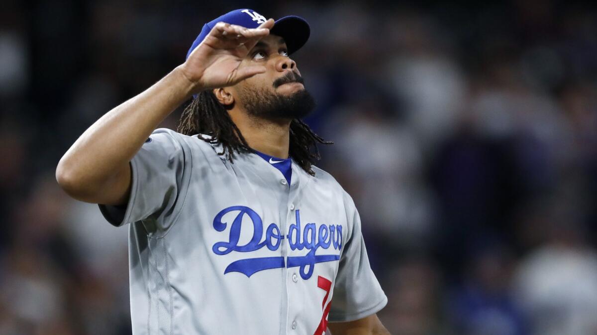 Dodgers closer Kenley Jansen walks off the mound at Coors Field after striking out Colorado Rockies pinch-hitter Garrett Hampson for the final out in a four-out save.