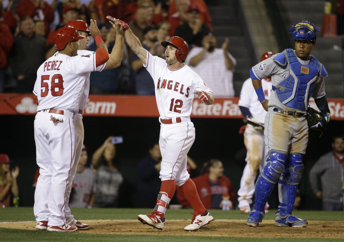 Angels second baseman Johnny Giavotella (12) celebrates after hitting a three-run home run against the Royals during the fifth inning of a game on April 26.