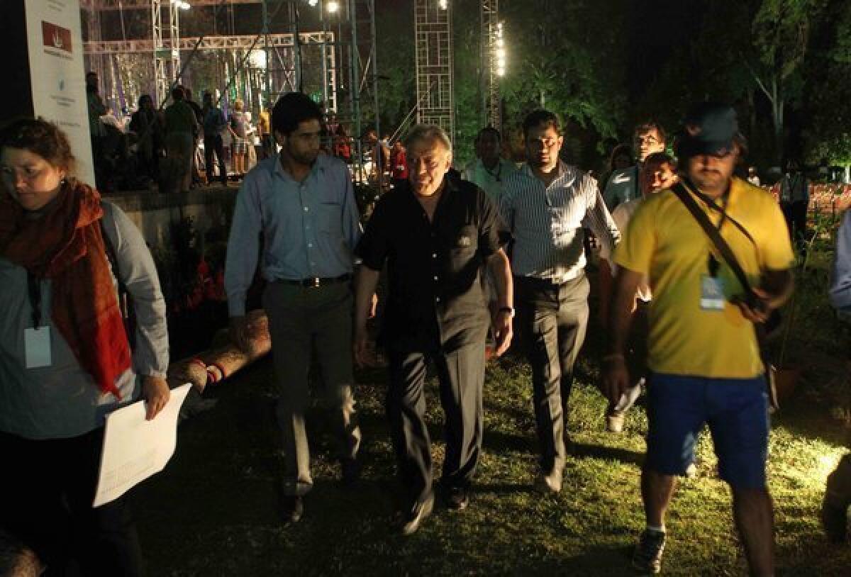 Zubin Mehta walks around the historic Shalimar Mughal Garden in Srinagar, the site of his planned peace concert in the Indian-controlled portion of Kashmir