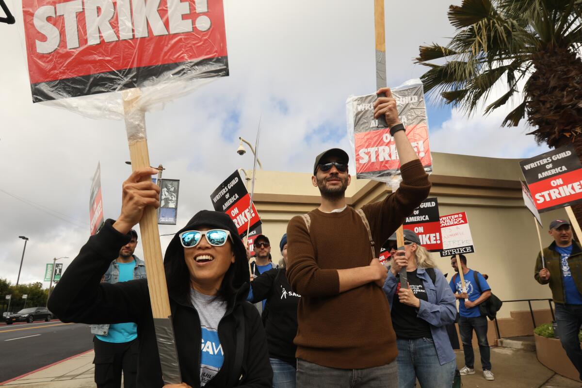 A large group of WGA members picket in front of the Paramount Studios gate in Los Angeles on May 4.