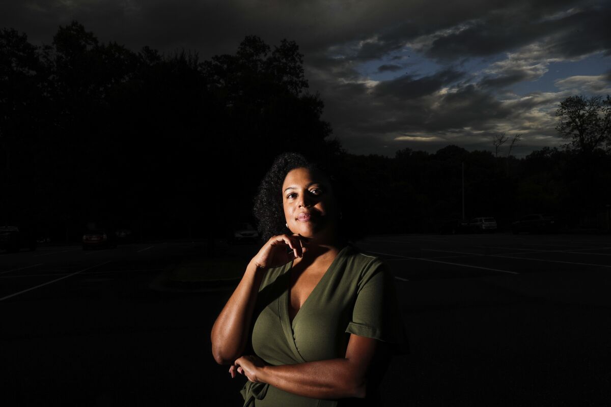 Charisse Davis poses for a portrait on Friday, July 24, 2020, in Marietta, Ga. Davis was recently elected the only Black woman on the Cobb County School Board. "We've been watching from the sidelines and allowing other people to take their turns, and take these positions of power," Davis said. "Now here we are to essentially fix it." (AP Photo/Brynn Anderson)