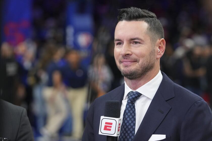 ESPN analyst JJ Redick looks at the camera prior to a game between the Knicks and 76ers