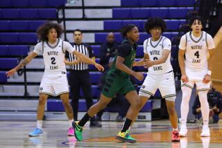 Zachary White (middle) with Sherman Oaks Notre Dame teammates Lino Mark (left) and Tyran Stokes.