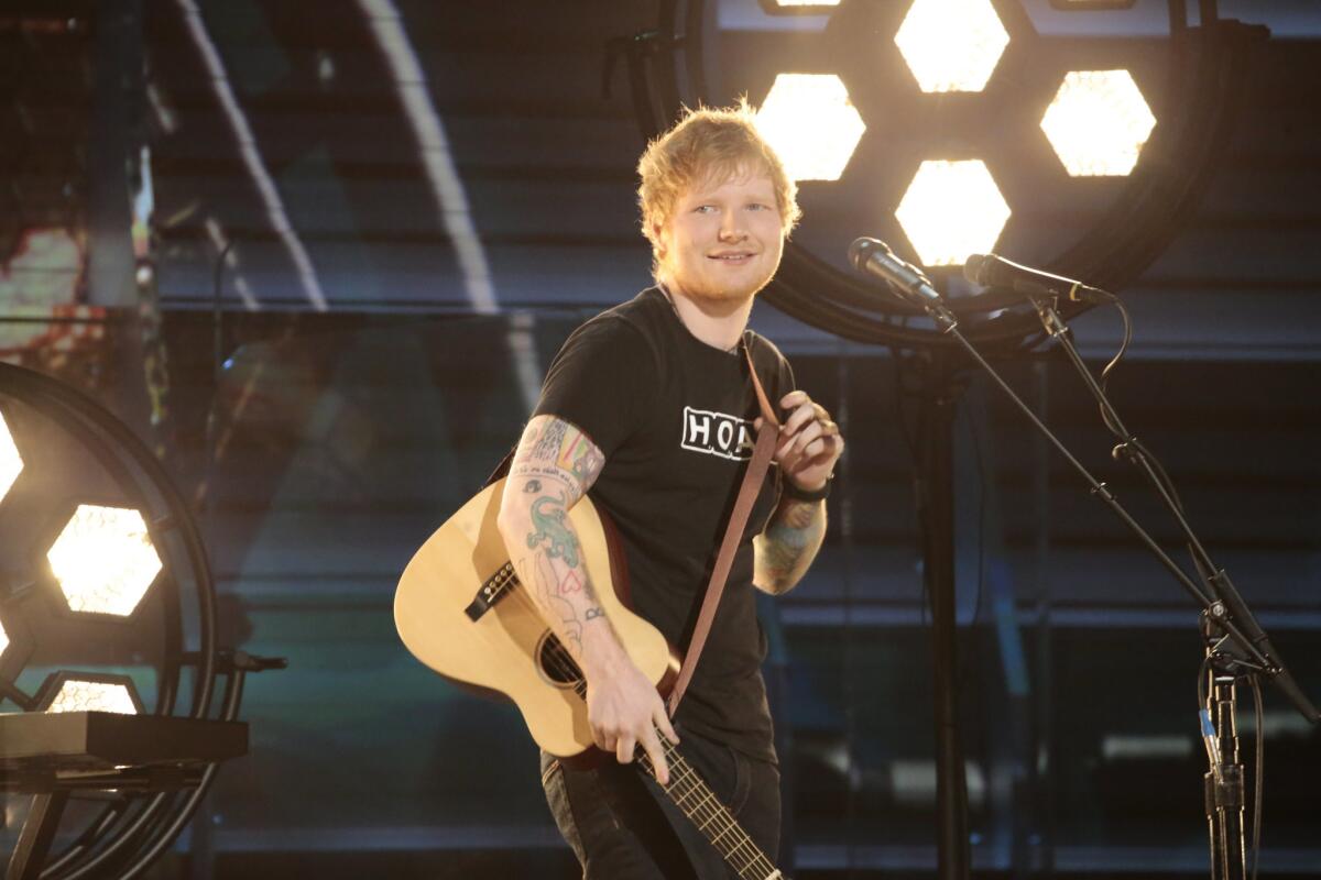 British singer-songwriter Ed Sheeran, shown at Sunday's 59th Grammy Awards in Los Angeles, posted the greatest song sales increase of all musicians who took part in this year's ceremony.