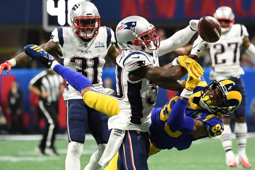 ATLANTA, GEORGIA, FEBRUARY 3, 2019 - Patriots' Jason McCourty, left, breaks up a pass intended for Los Angeles Rams' Josh Reynolds during the first half Super Bowl LIII at Mercedes-Benz Stadium.
