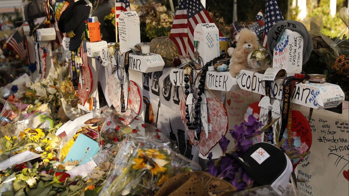 Crosses bear the names of the victims of the Borderline shooting in Thousand Oaks, Calif. on Nov. 27.
