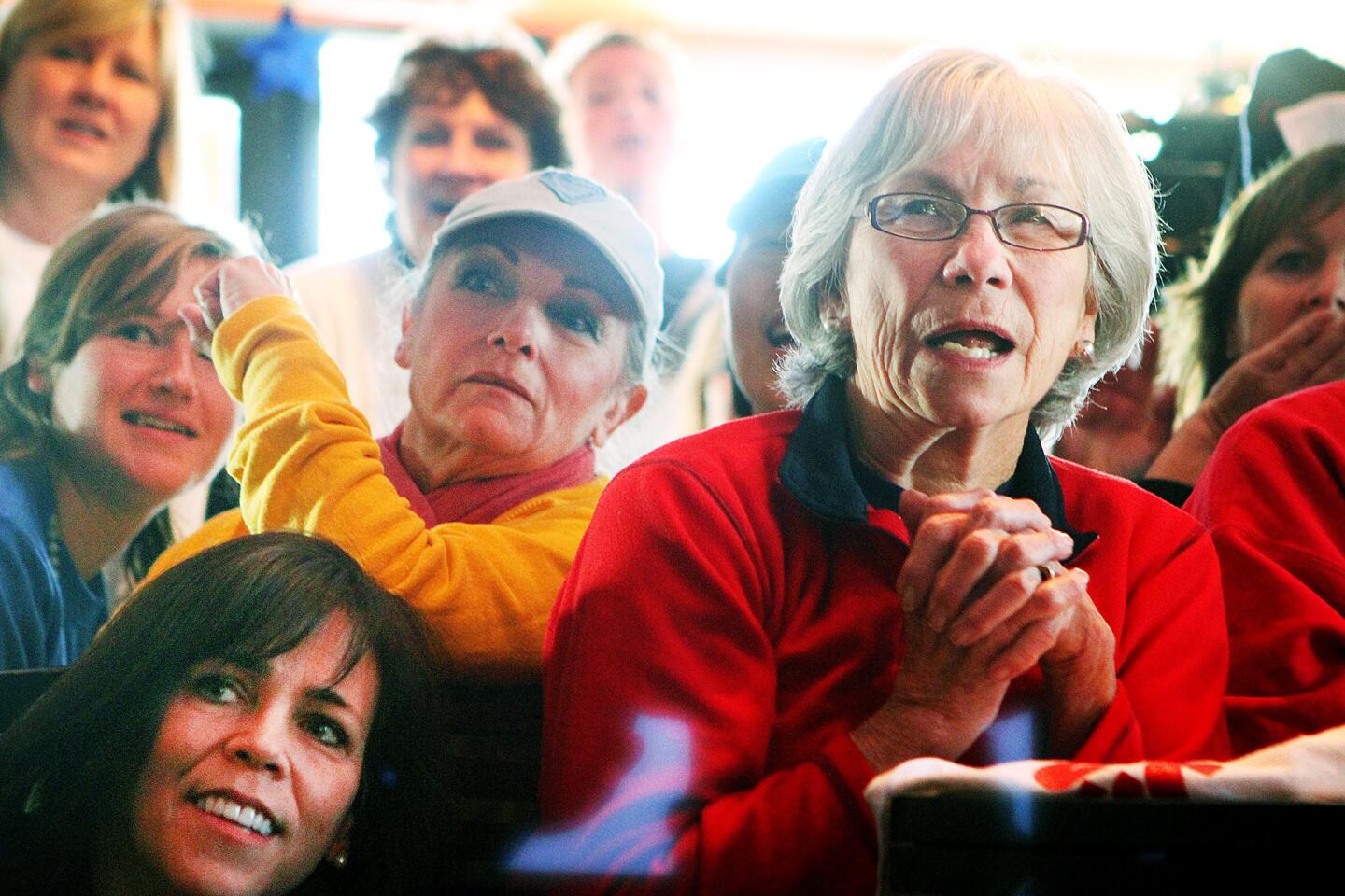 Mary Ohms, of La Canada, who has known Kate Hansen since she was a student at La Canada High School, closely watches her friend race in the Olympics at Sochi, Russia in the first day and second run of the luge competition at Los Gringos Locos in La Canada Flintridge on Monday, February 10, 2014. After two runs, local Olympian luger Kate Hansen is in 10th place.