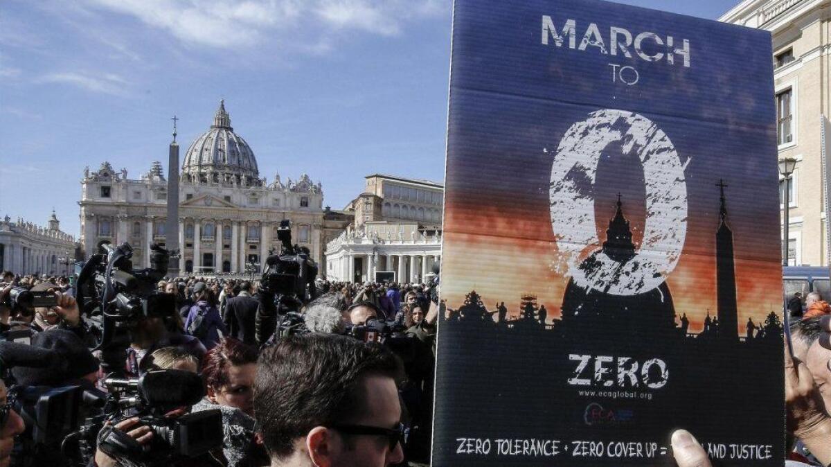 Activists from the Ending Clergy Abuse organization protest in St. Peter's Square in the Vatican on Feb. 24.