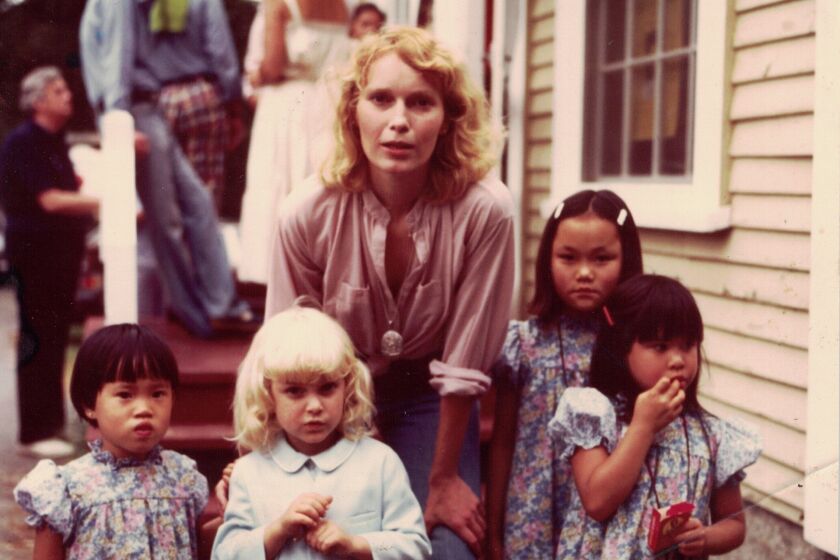 Mia Farrow (center) with her children. From left: Daisy, Fletcher, Soon-Yi and Lark Previn in a scene from 'Allen v. Farrow'