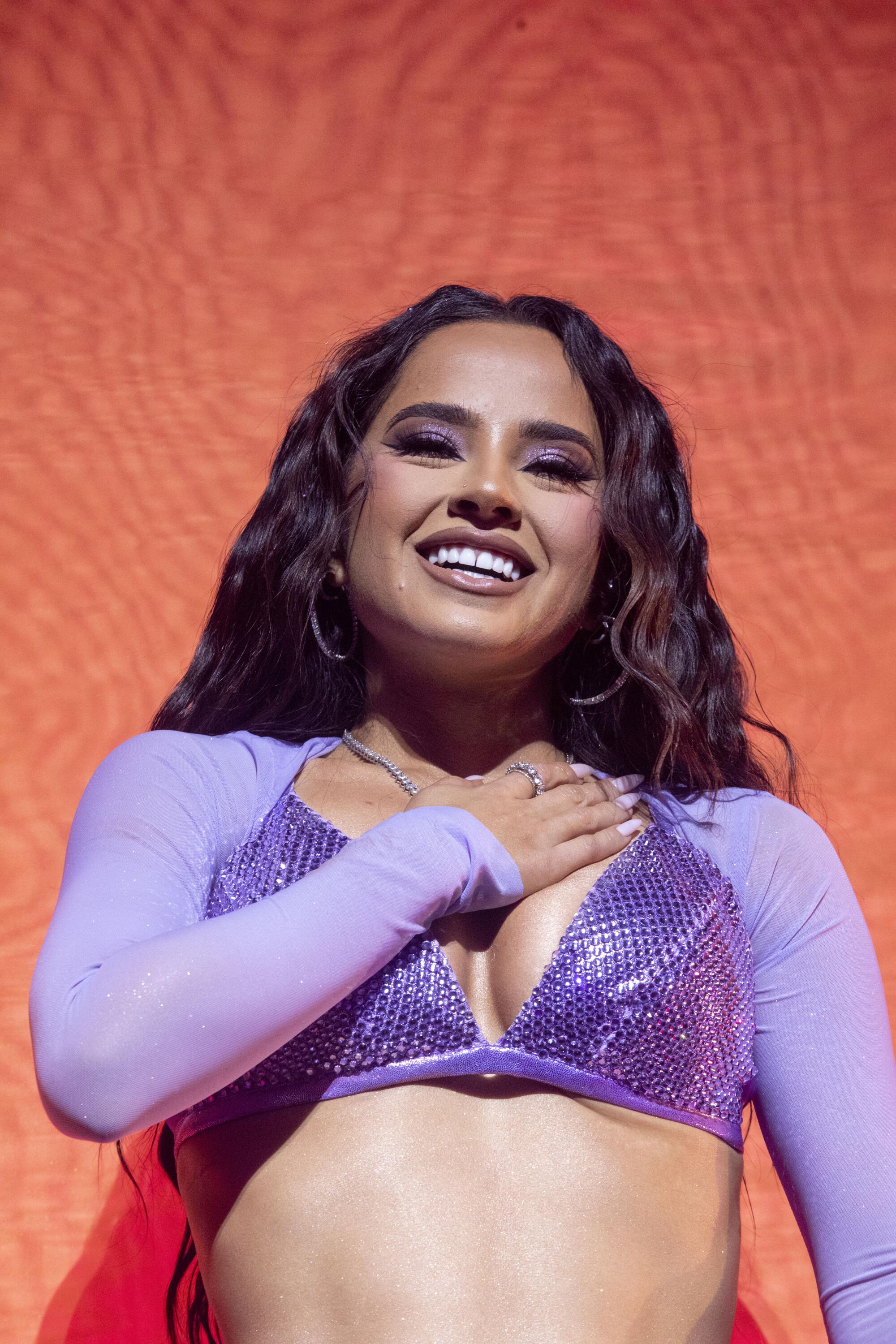 Becky G puts her hand on her heart in a concert at the Novo in downtown Los Angeles