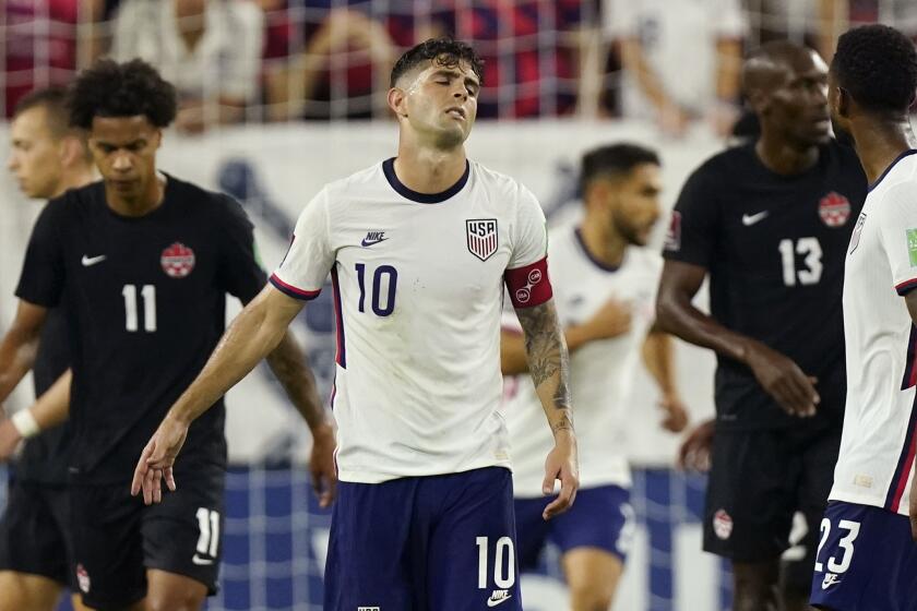 United States forward Christian Pulisic (10) reacts to missing a shot against Canada.
