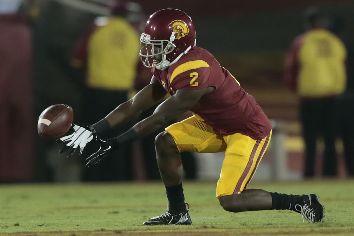 USC's Adoree' Jackson fields a bouncing punt against Arkansas State on Saturday.
