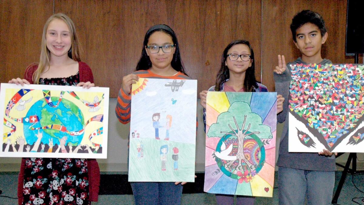 Burbank winners of the Lions Clubs International Peace Poster Contest are, from left, Lillian Raesler, Ivette Silva, Madison Gomez and Angel Quinonez.