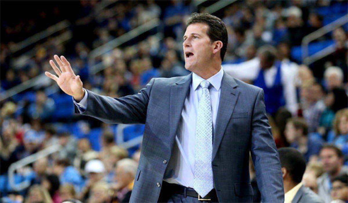 Coach Steve Alford gives instructions to the Bruins during a game earlier this season against Morehead State at Pauley Pavilion.