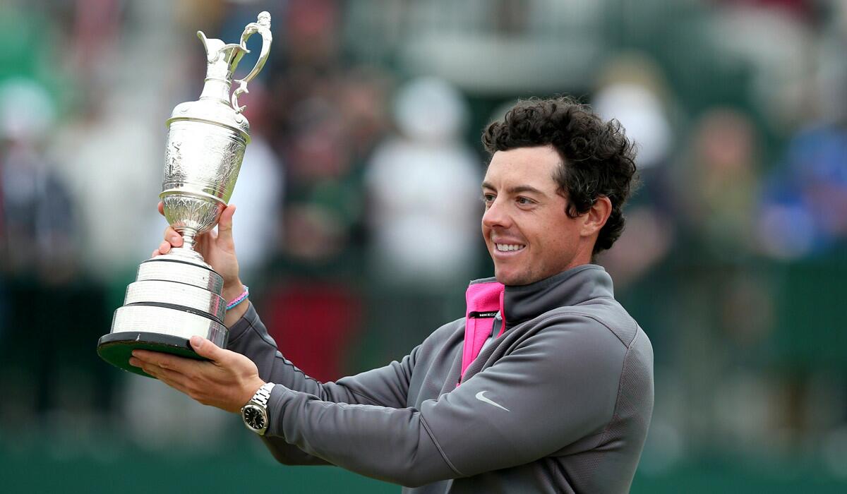 Rory McIlroy holds up the Claret Jug after winning the British Open on Sunday at Royal Liverpool in Hoylake, England.