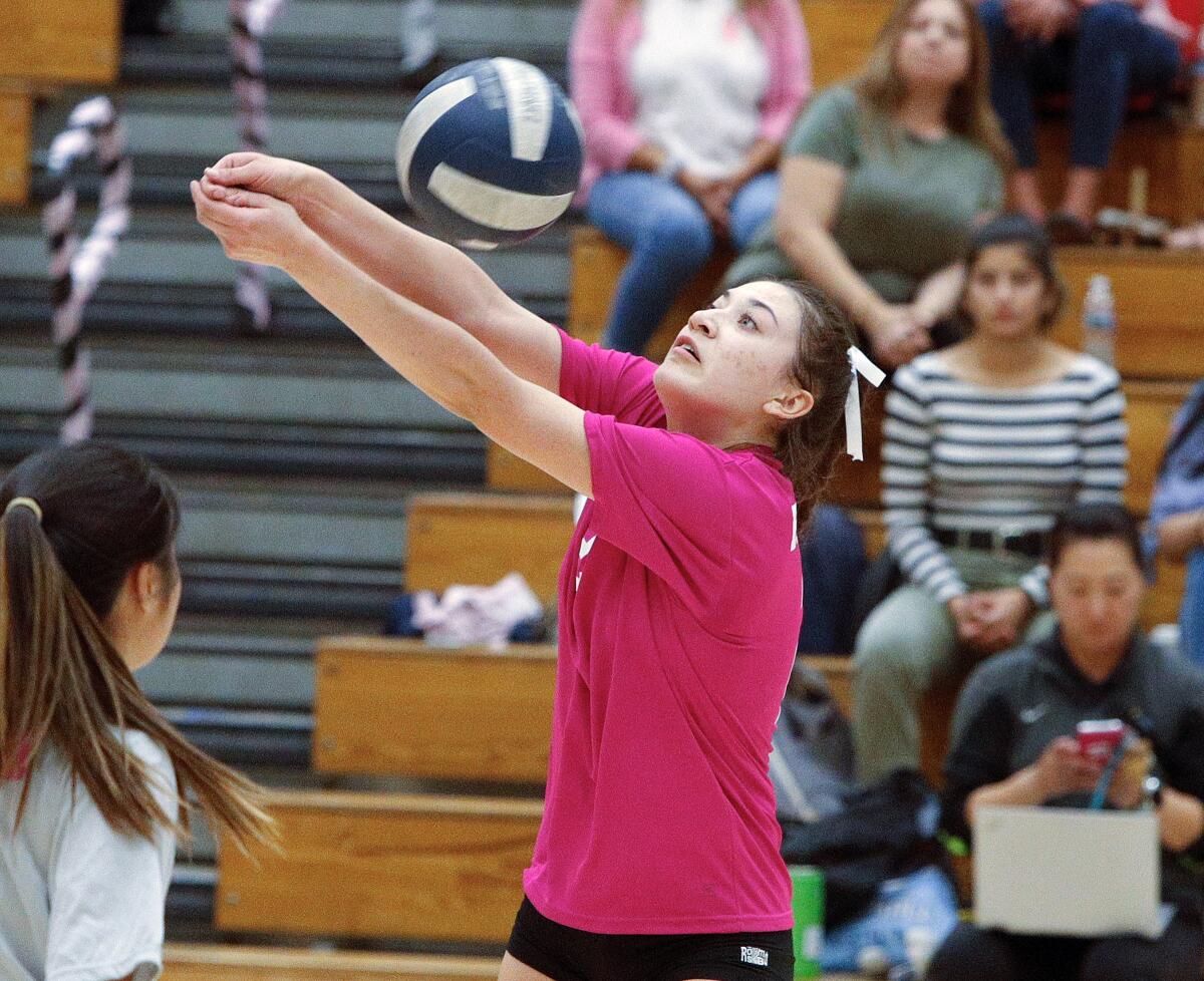 Burbank's Katie Treadway hits a free ball back to Crescenta Valley in a Pacific League girls' volleyball match at Crescenta Valley High School on Thursday, October 10, 2019.in a Pacific League girls' volleyball match at Crescenta Valley High School on Thursday, October 10, 2019. Both teams wore the exact same color pink jersey in honor of Breast Cancer Awareness month.