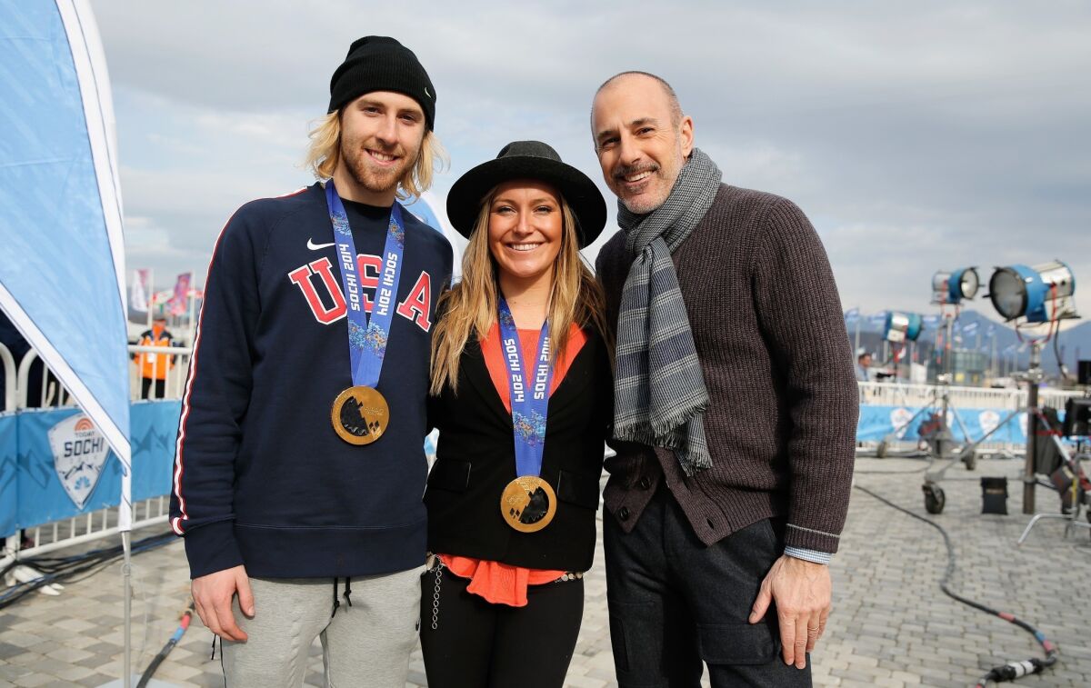 Sage Kotsenburg and Jamie Anderson of the USA Snowboarding team pose with their gold medals and Matt Lauer of NBC's "TODAY Show," who will be taking over for Bob Costas.