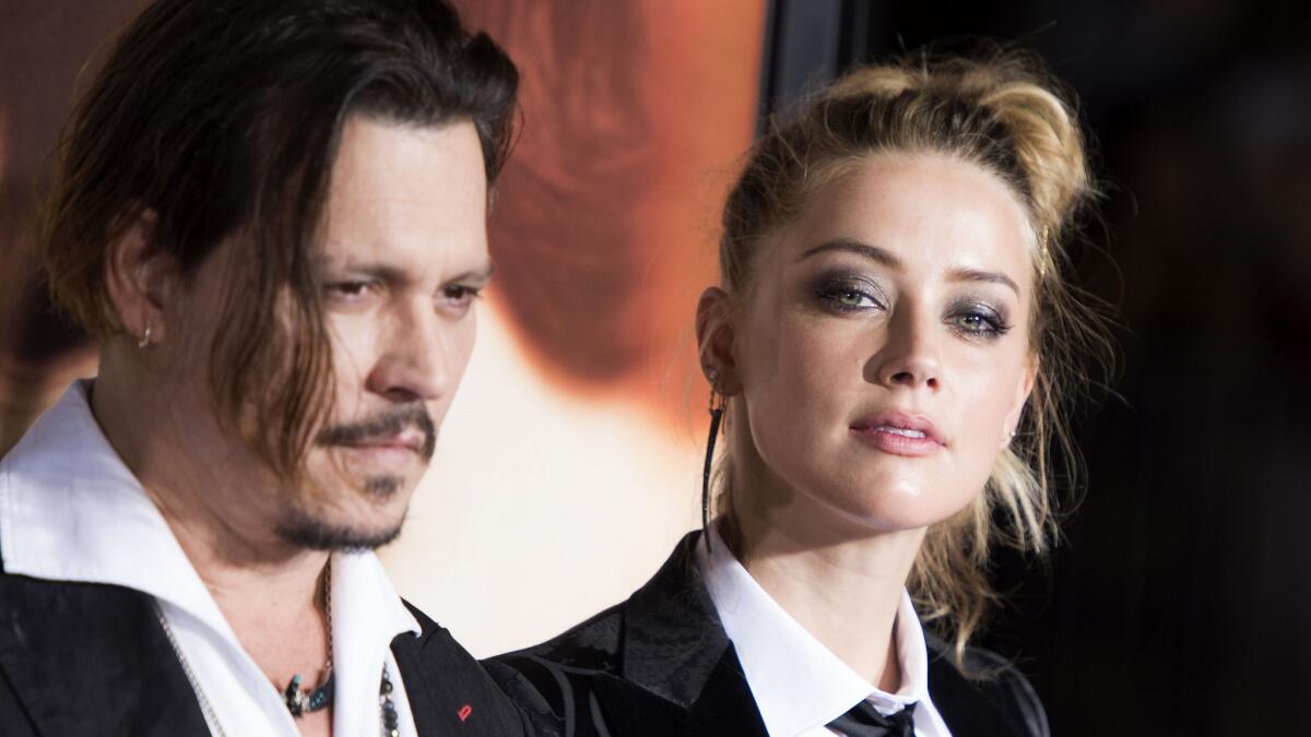 Johnny Depp and Amber Heard attend the Los Angeles premiere of "The Danish Girl" in Westwood on Nov. 21.