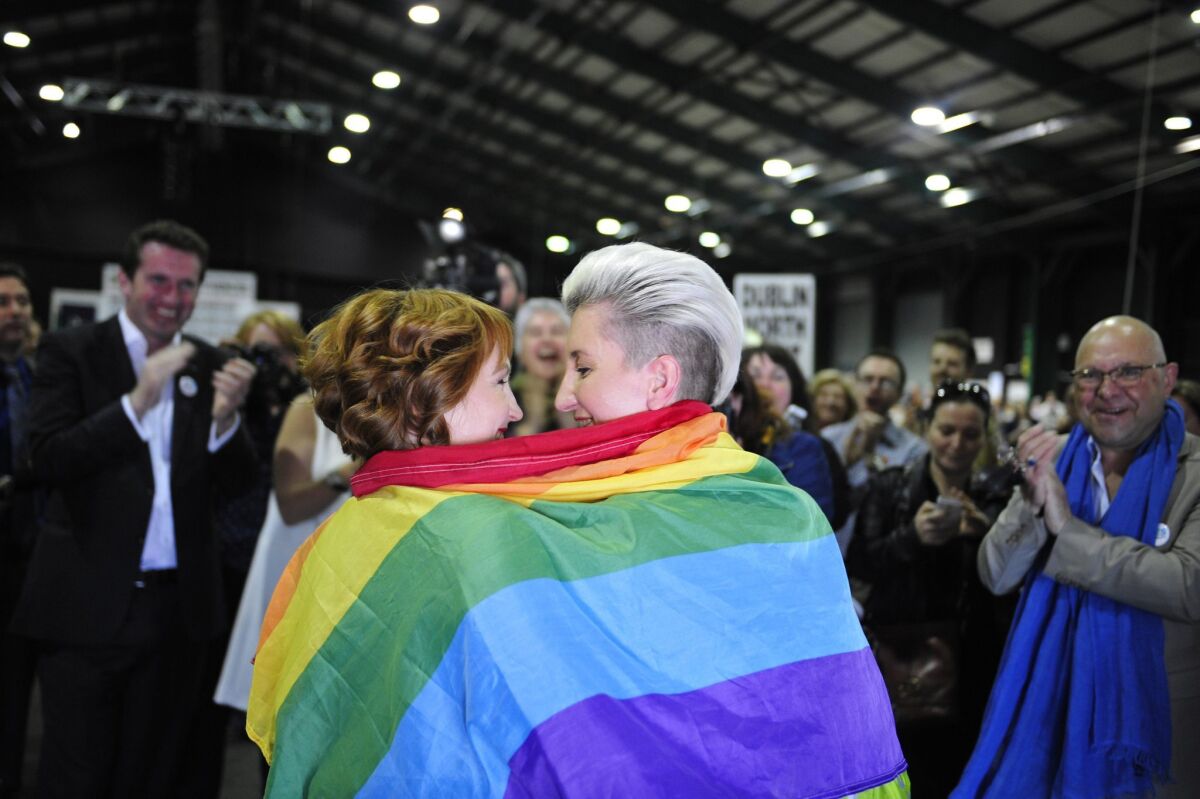 Monnine Griffith, left, and Clodagh Robinson celebrate after early results suggested an overwhelming majority in favor of the Irish referendum on same-sex marriage.