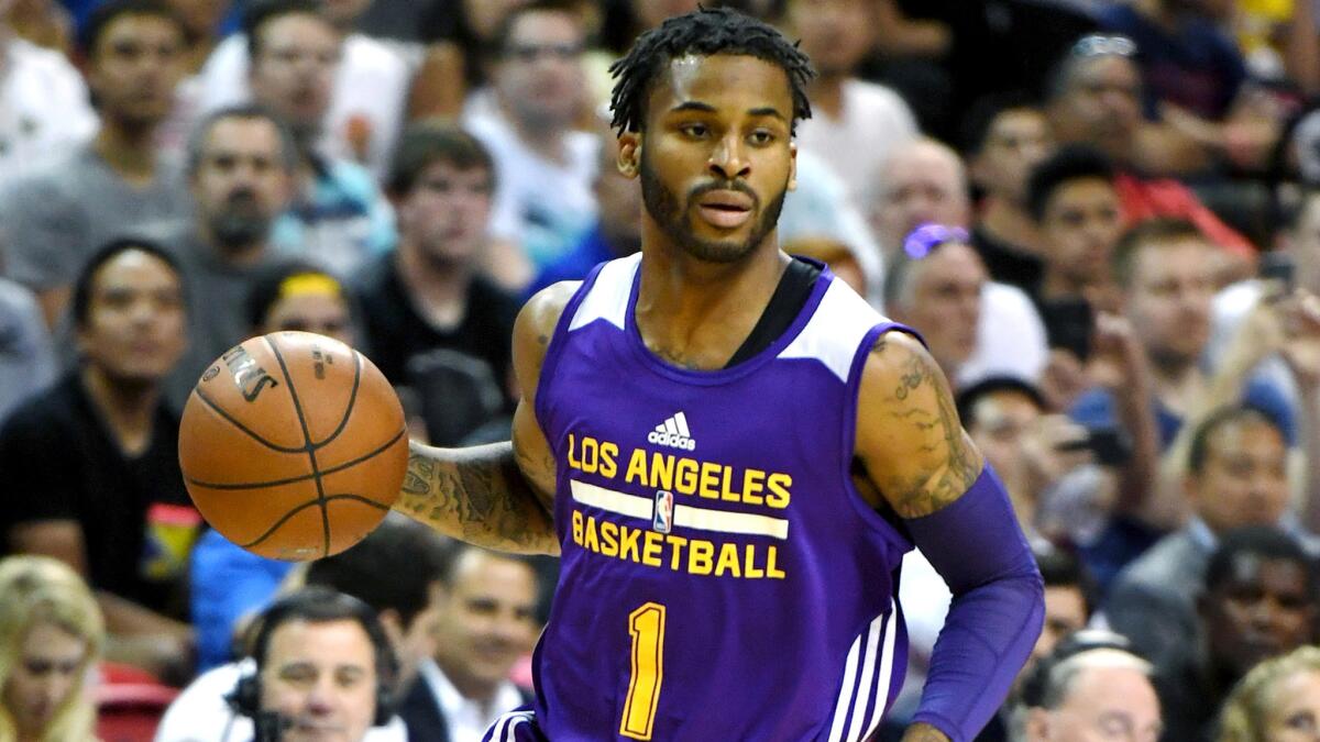 Lakers guard Vander Blue brings the ball up the court against the Cavaliers during an NBA Summer League game in Las Vegas on July 13.