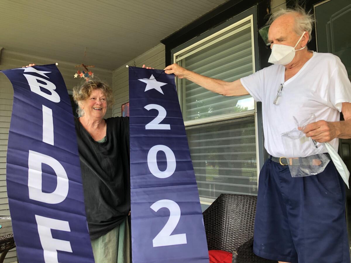 Kenosha natives Susan Hannes and Dick Hannes unfurl new "Biden 2020" flags